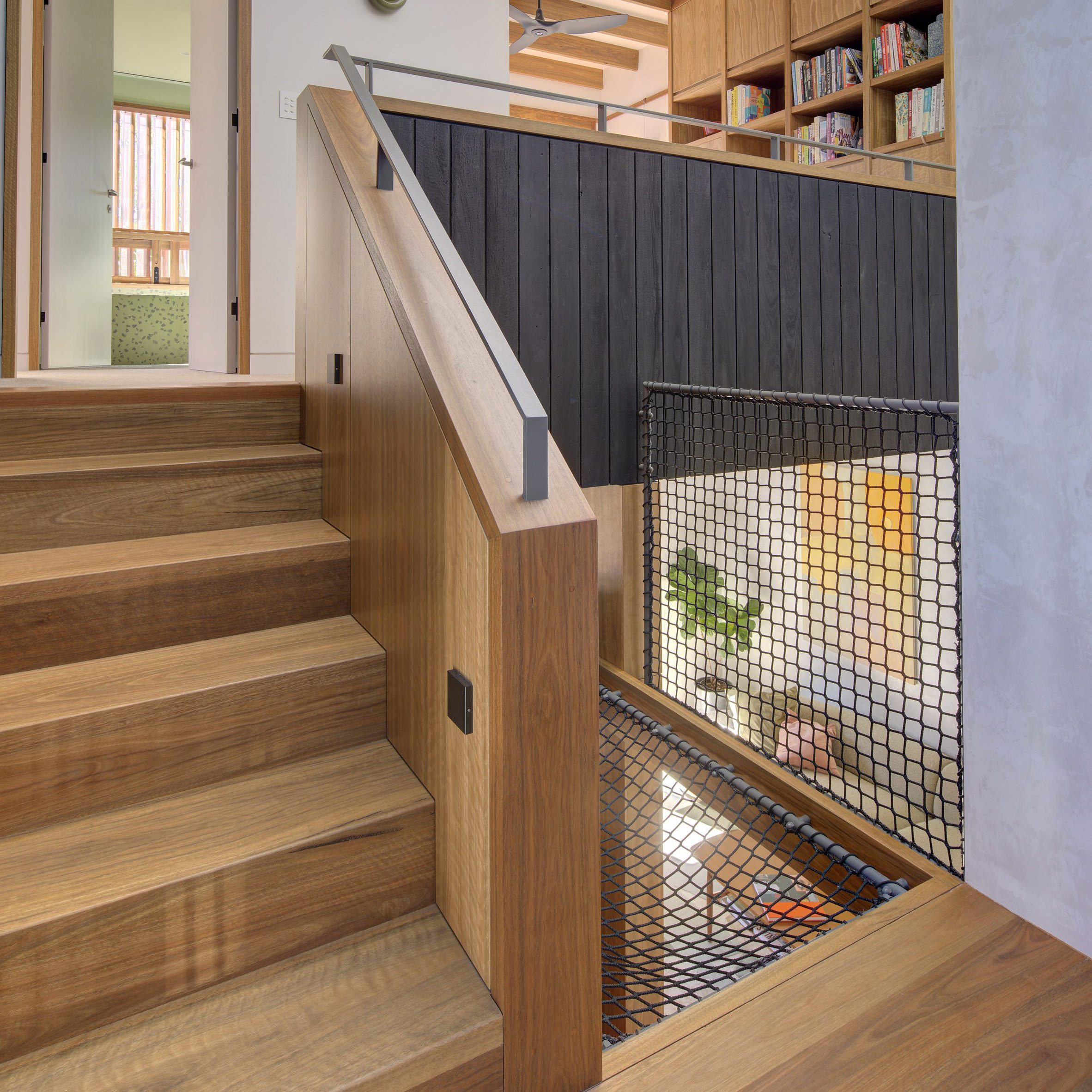 wood staircase with a net seat