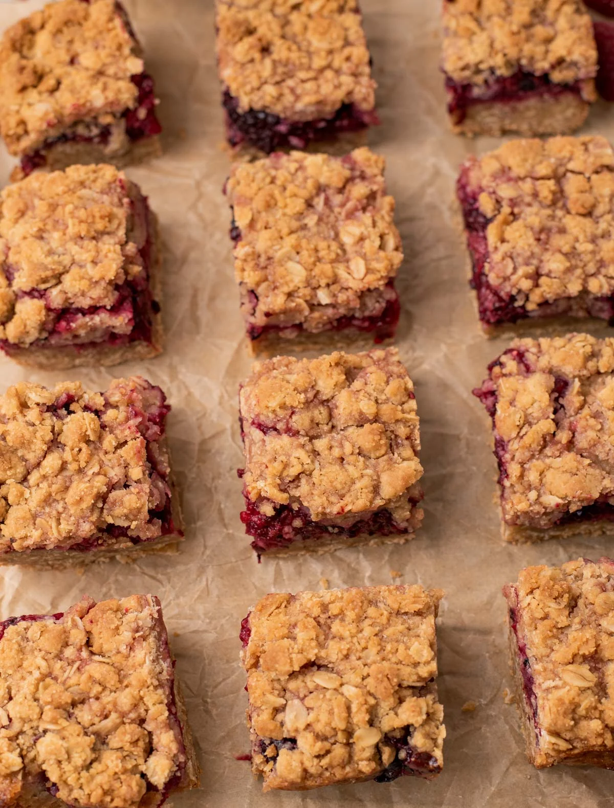 evenly spaced shortbread bars lined up on parchment paper