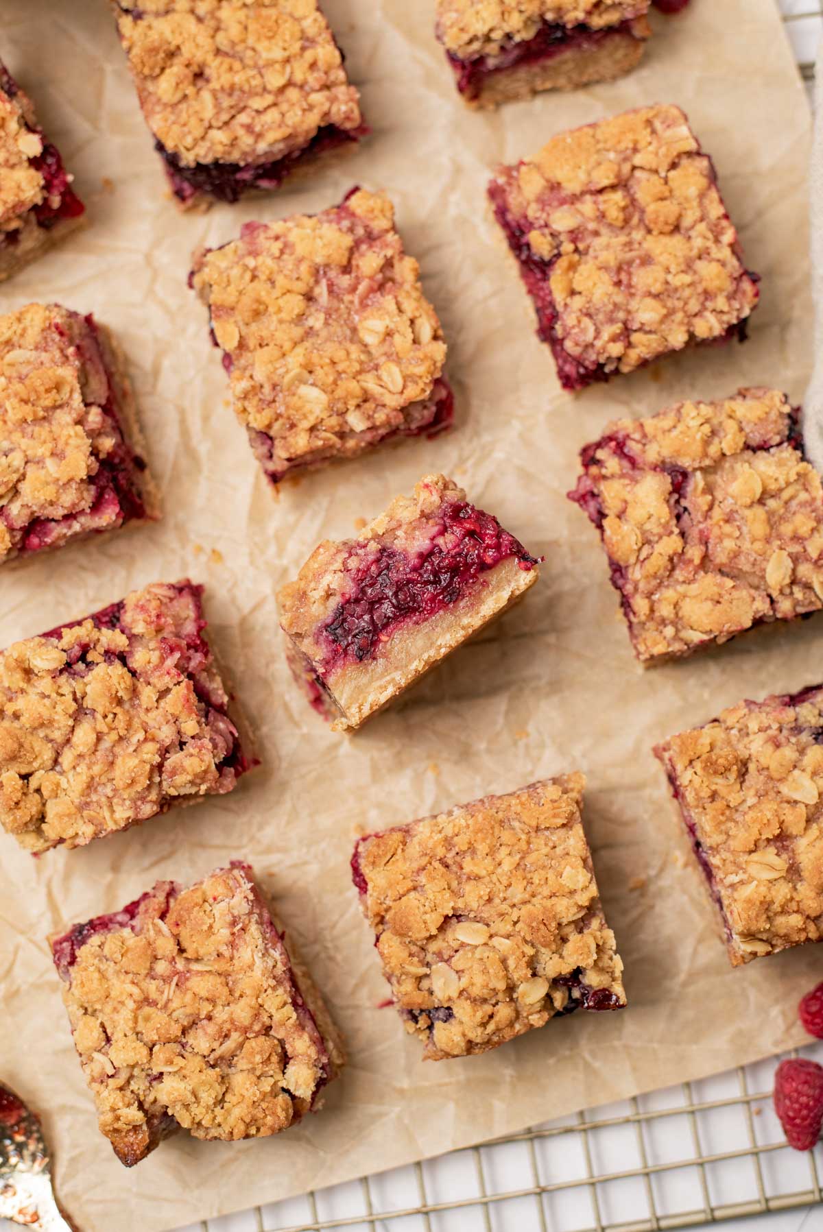 berry bars all lined up on parchment paper