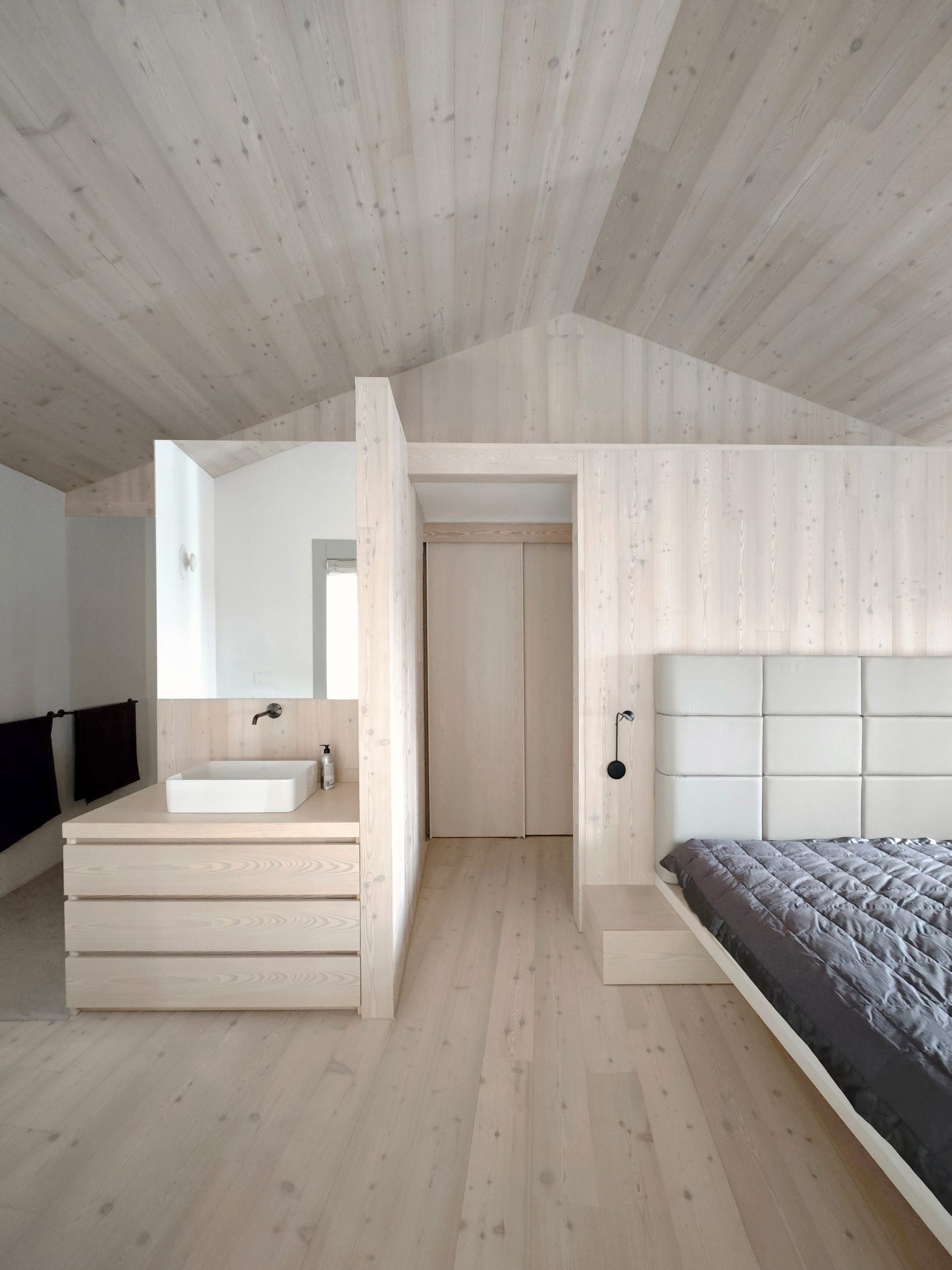 wood-lined bedroom