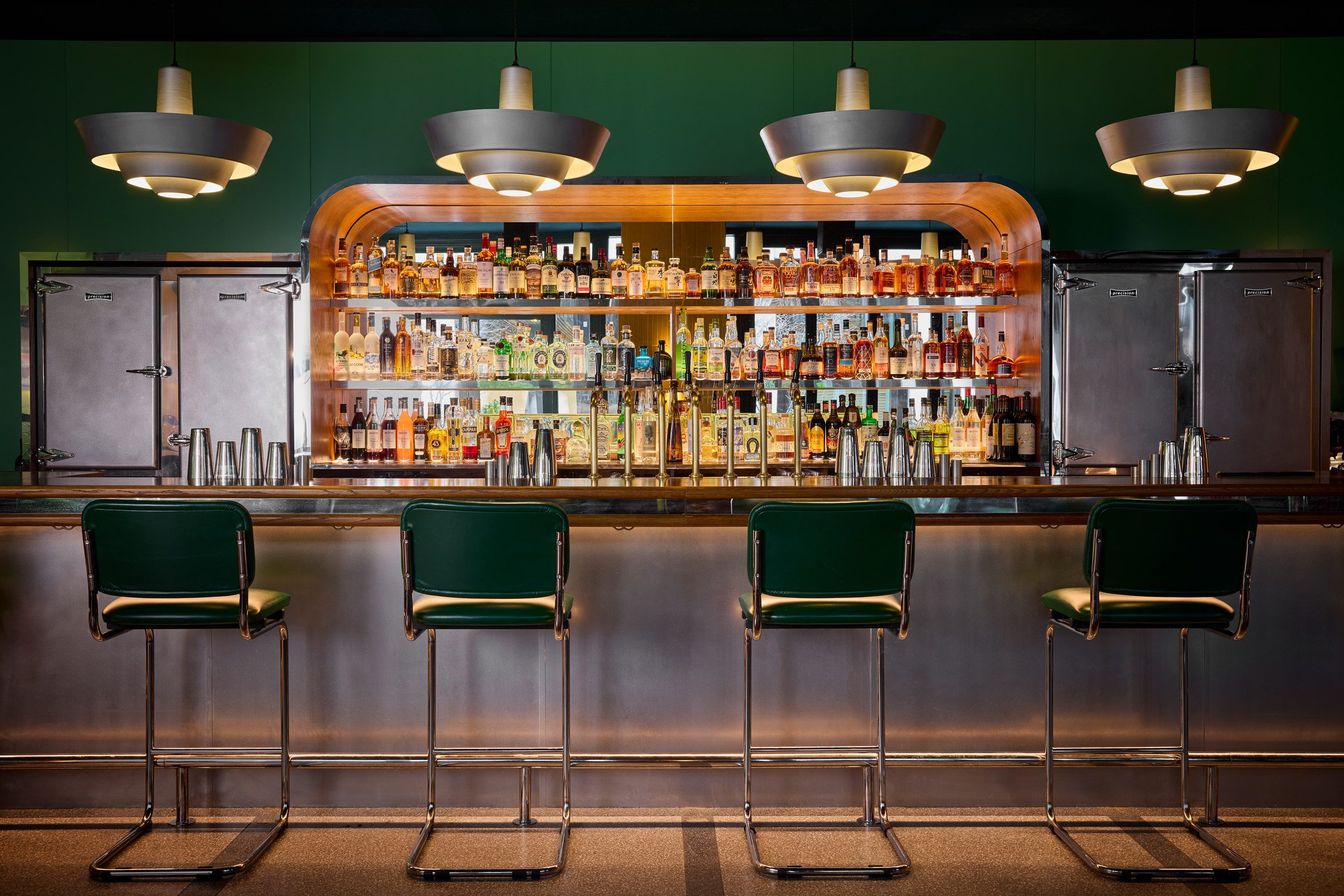 steel bar and green walls at motorino