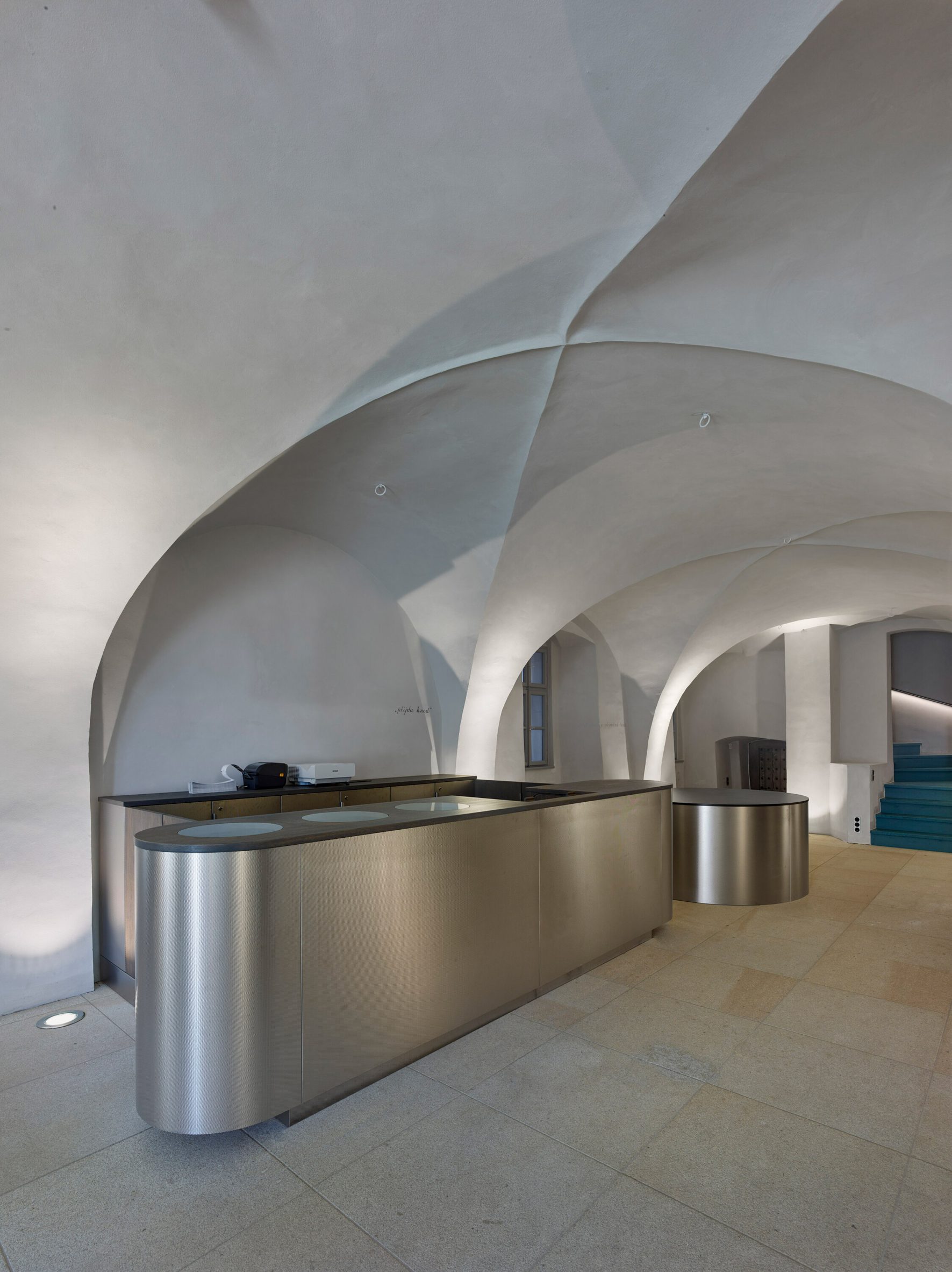 silver kitchen in a vaulted room