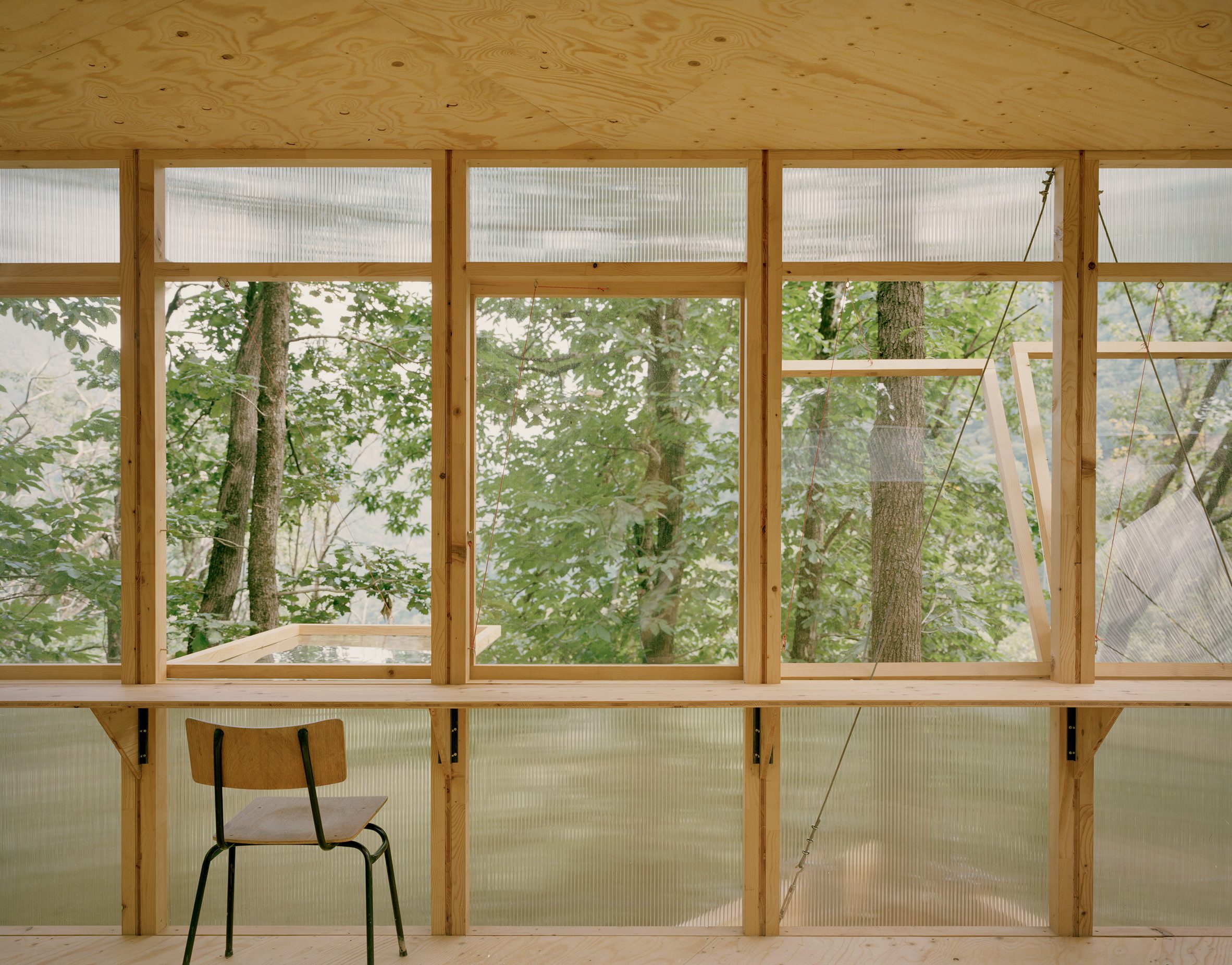 wood and polycarbonate treehouse in switzerland
