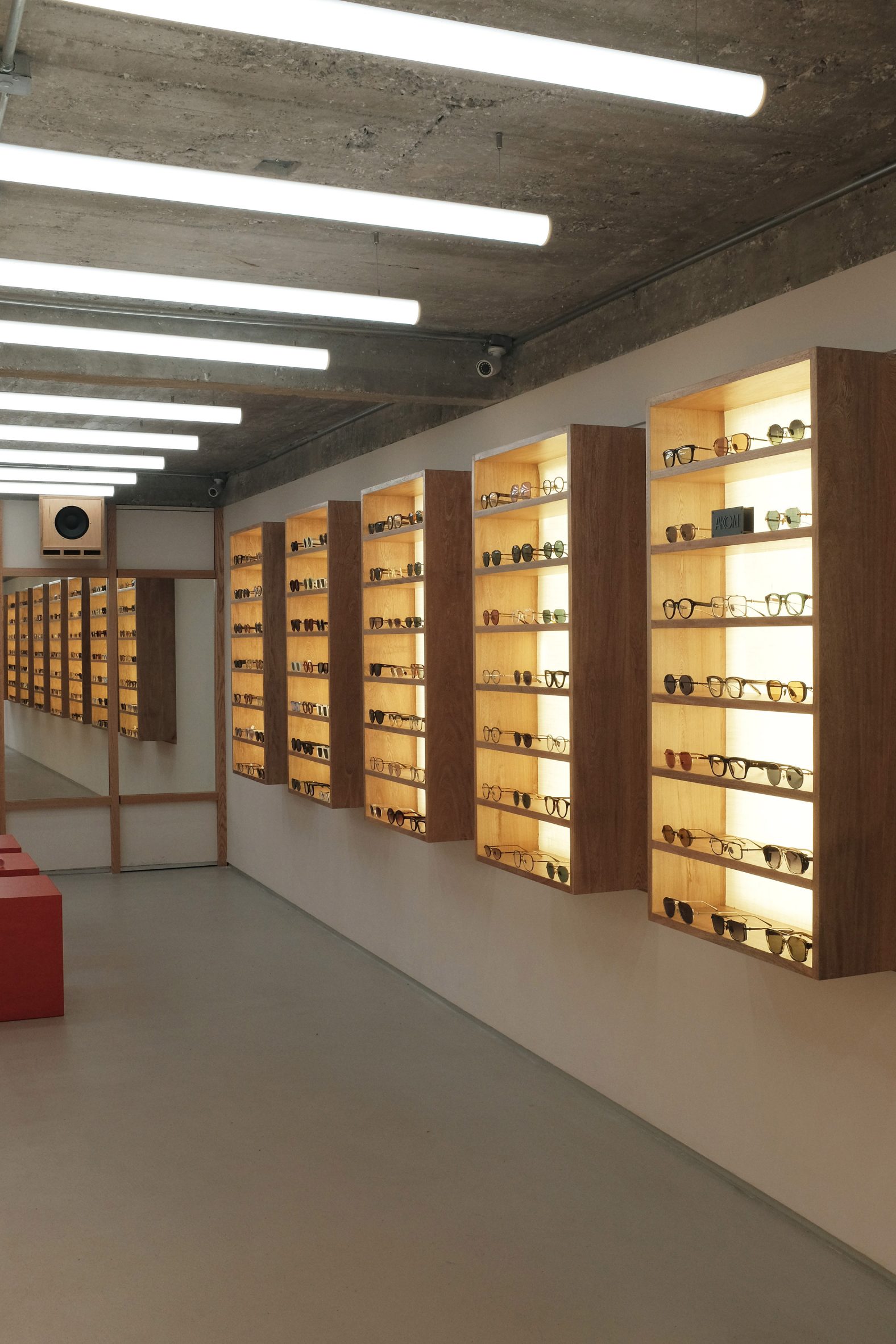 frames displayed in modular wall-mounted oak boxes