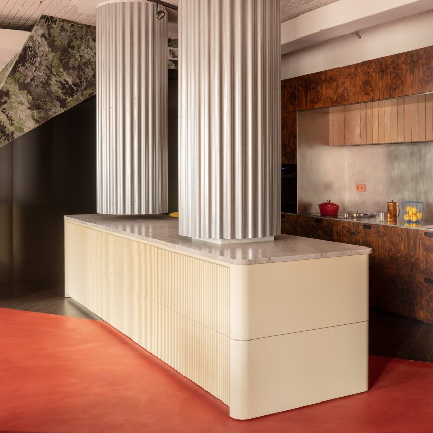 Tabula Studio combines bold red floors and trompe l'oeil details in Bilbao office