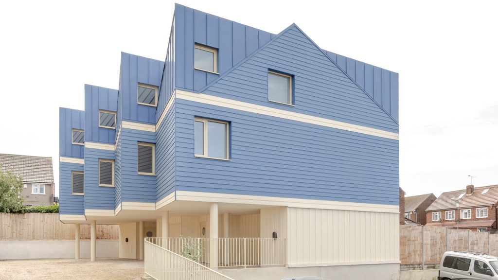 Office S M takes aim at generic suburbia with blue mews block in Kent