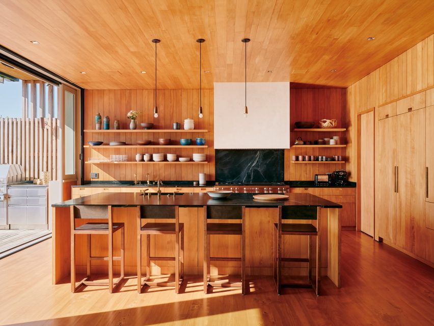 eight global kitchens filled with warm natural wood 7 wood-panelled kitchen in surf house