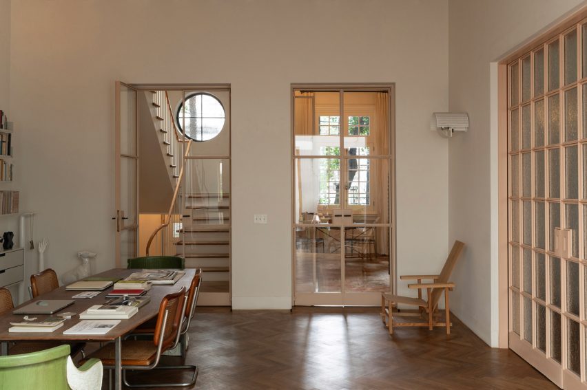rooms connected by glass french doors that allow light to pass between