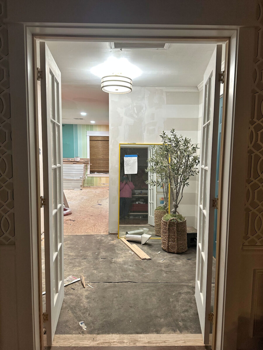 an aerial view of waves crashing against a shore.