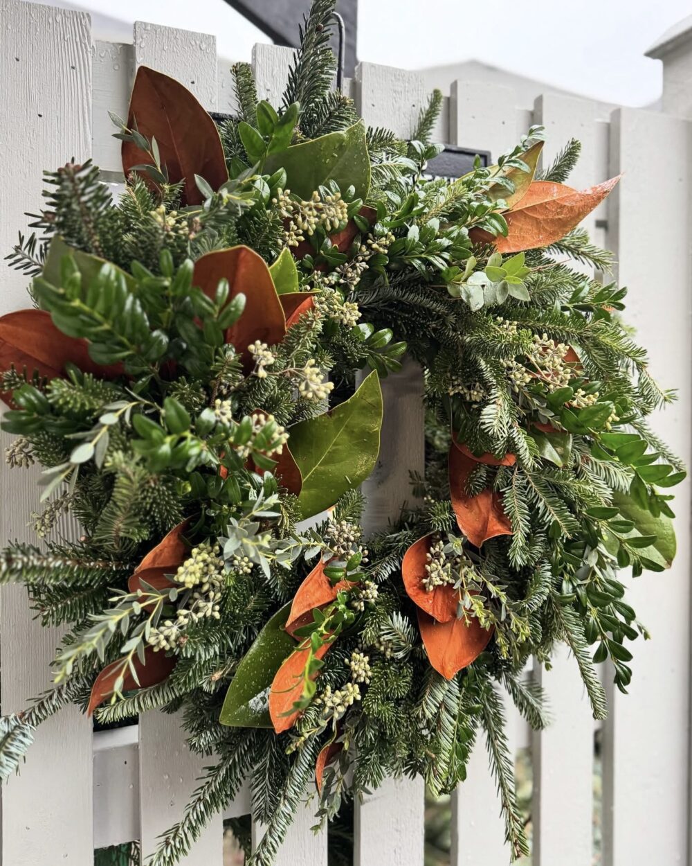 homemade wreath with fir and magnolia
