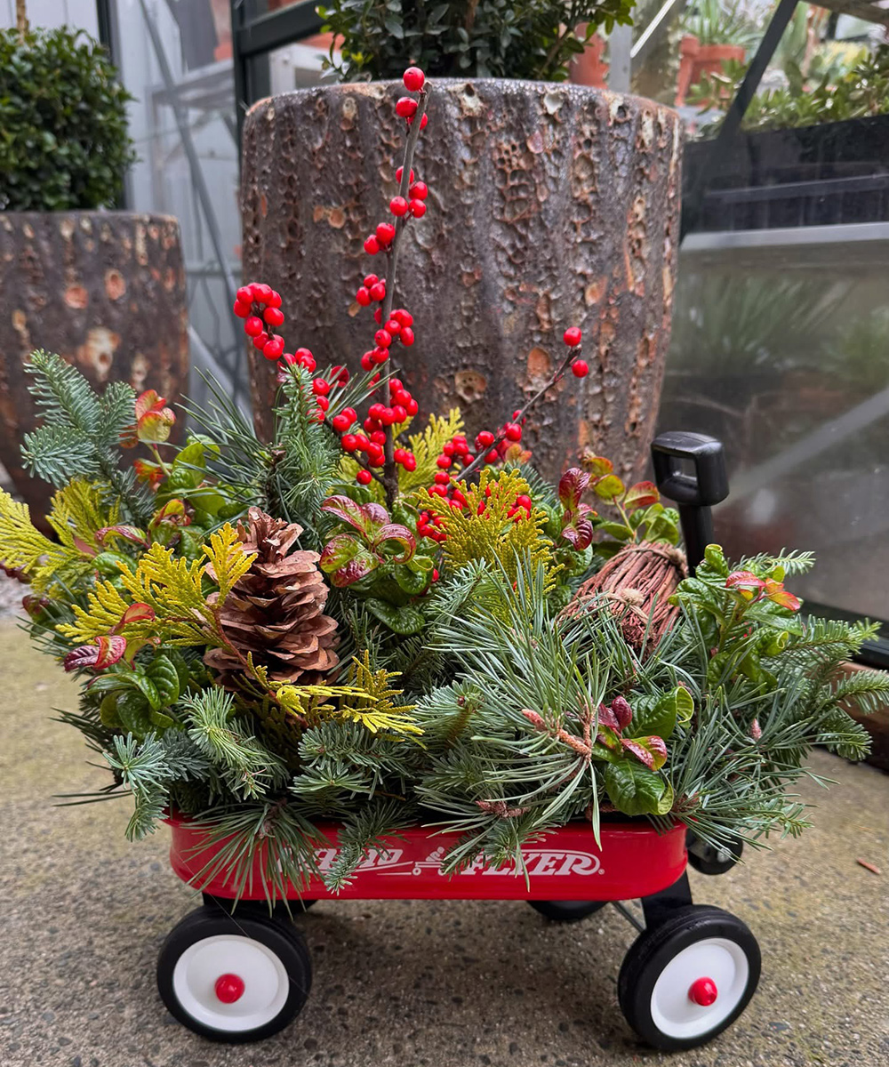 winter container arrangement in red wagon