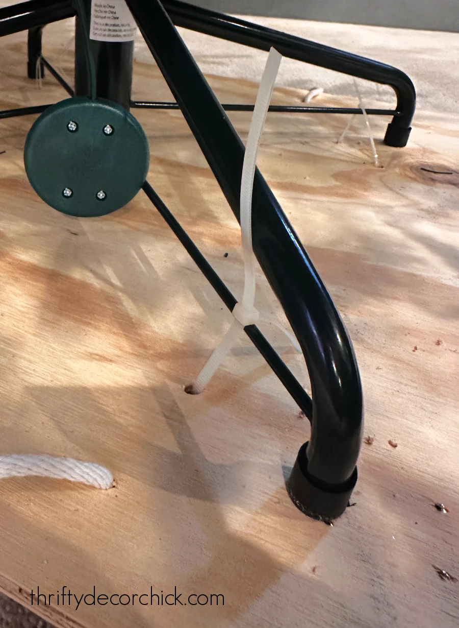 zip ties holding christmas tree stand