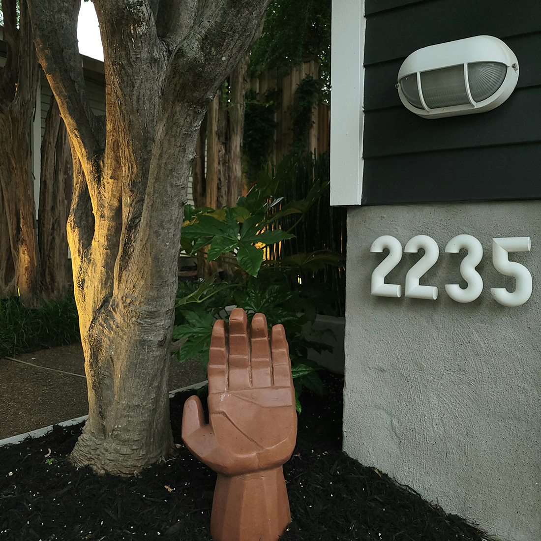 shady garden corner with unique hand garden art