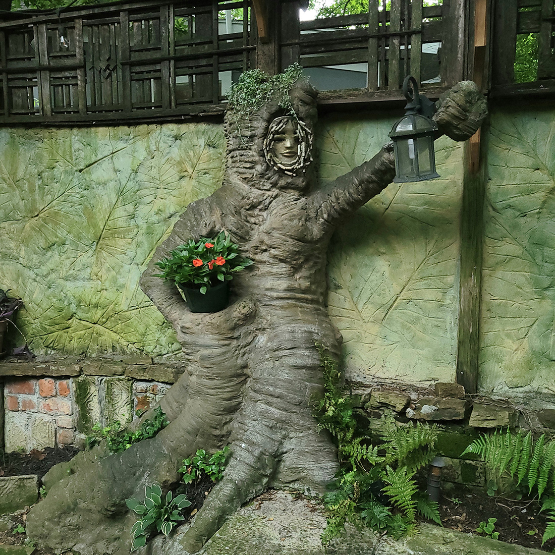 concrete statue that looks like old tree stump