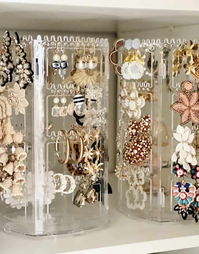 10 unexpected organizing ideas you may not have thought of 4 an organized acrylic jewelry holder displaying a collection of earrings, with various designs including floral and bejeweled styles, showcasing how to organize.