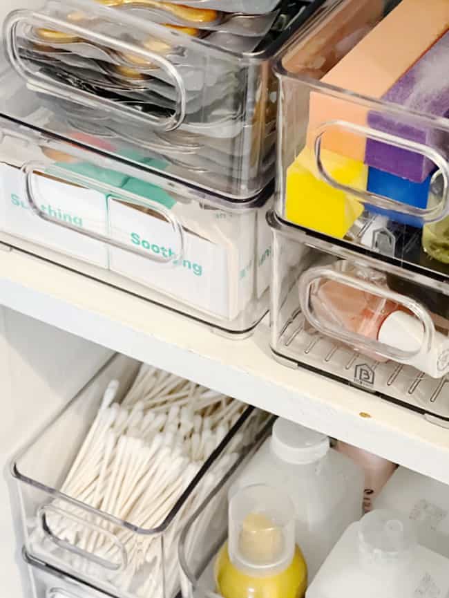 10 unexpected organizing ideas you may not have thought of 11 organized clear plastic storage drawers neatly labeled with contents such as "slimming" and "soothing," containing a variety of personal care items, demonstrate how to organize, arranged on a white shel