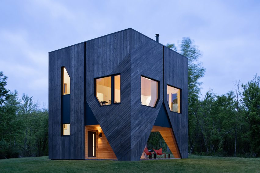 cedar-clad house at night