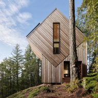 forma lifts hudson valley cedar-clad cubic house on angled legs 5 off-grid cabin
