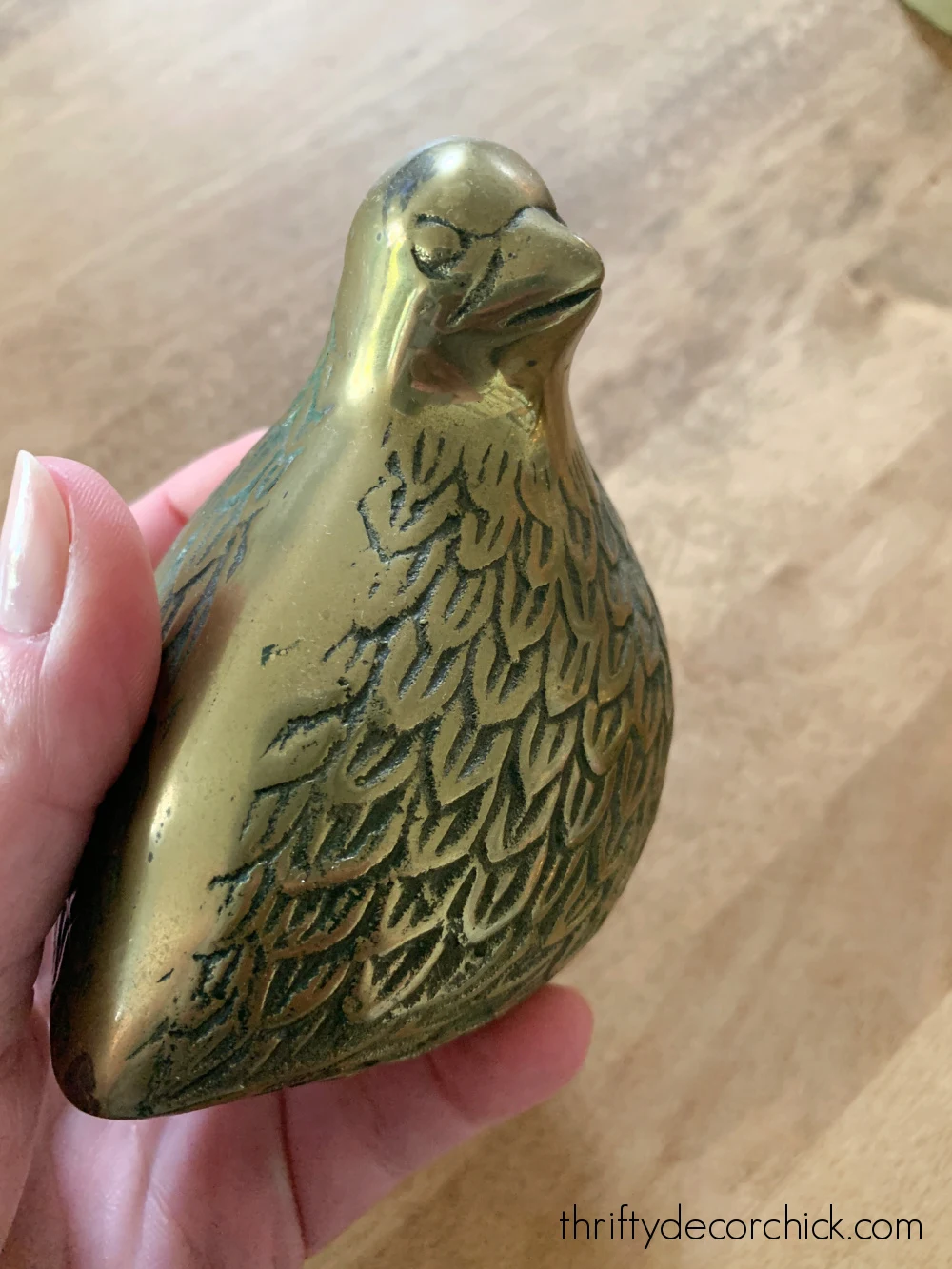 tarnished vintage bird figurine