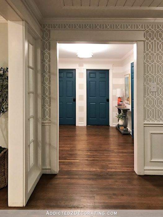 hallway after remodel - teal doors, striped walls, view from music room