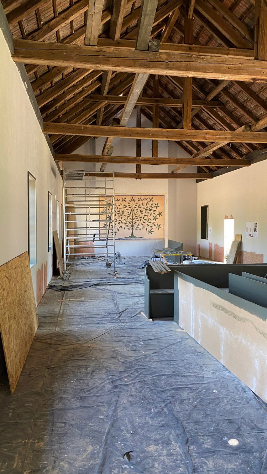 behind the scenes photo of the shaker meeting hall interior set under construction for the testament of ann lee