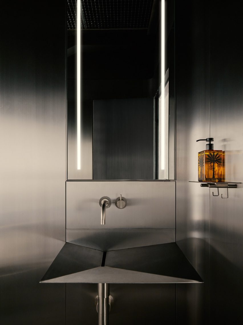 powder room with metallic walls