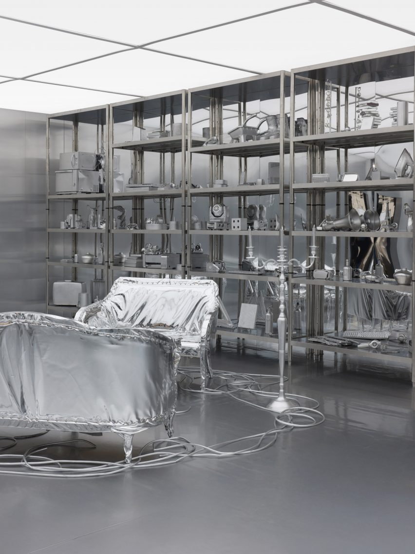silver sofas and shelves in a silver room