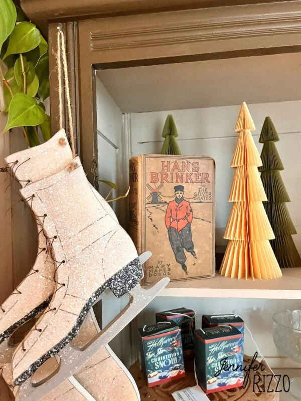 different ways to use vintage books in decorating 7 vintage ice skate book with ice skates and paper trees