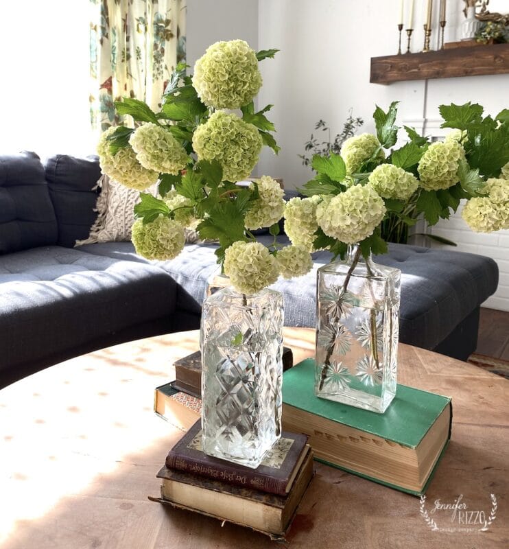 different ways to use vintage books in decorating 10 coffee table display idea with vintage crystal decanters