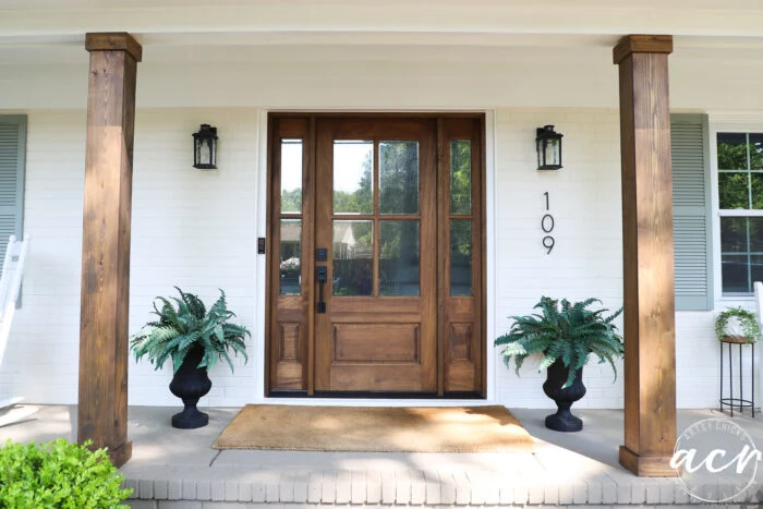 front door with 2 of the 4 columns stained