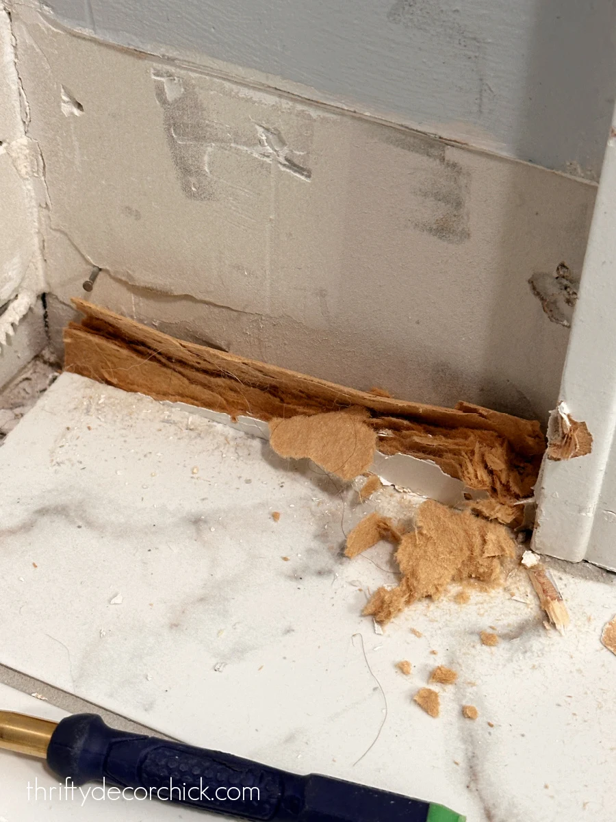 removing baseboards behind tile