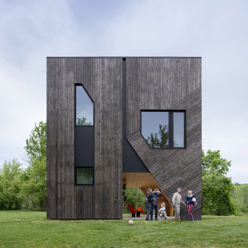 Forma lifts Hudson Valley cedar-clad cubic house on angled legs