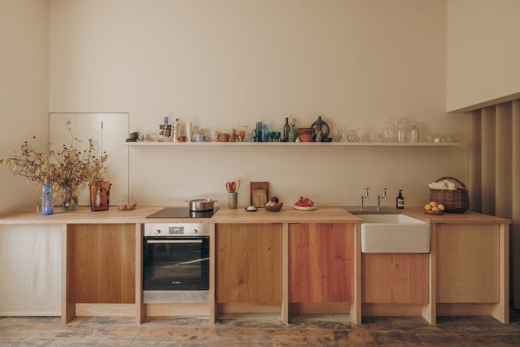 Inside a Sustainable Edinburgh Kitchen with a Rainbow of Surplus Wood Cabinets