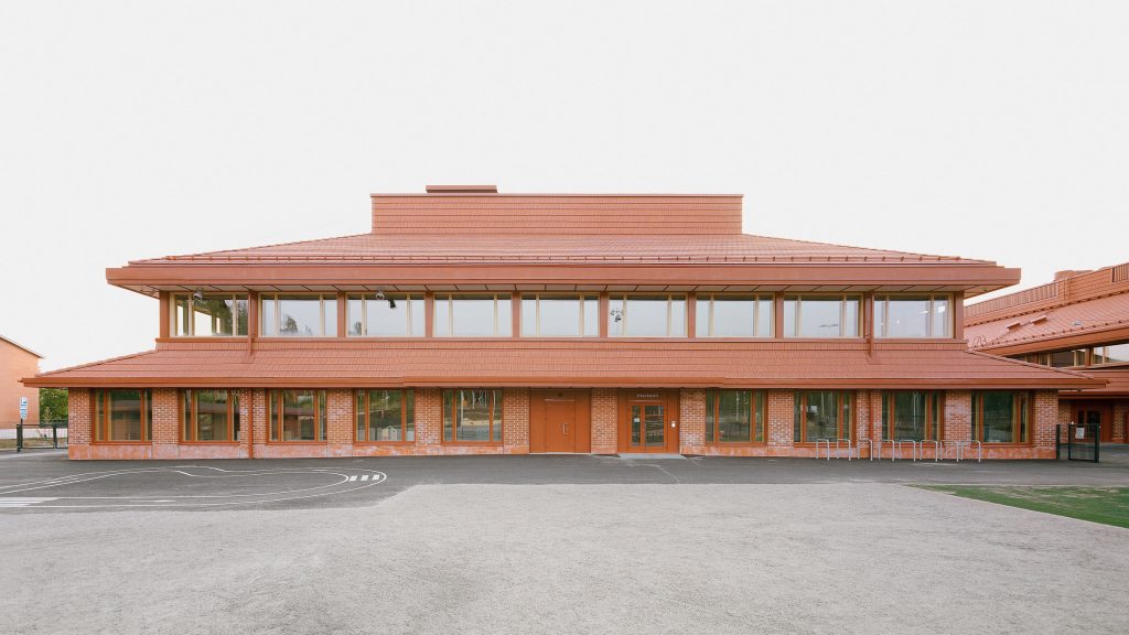 Terracotta defines community centre in Finland by Nervin Architecture