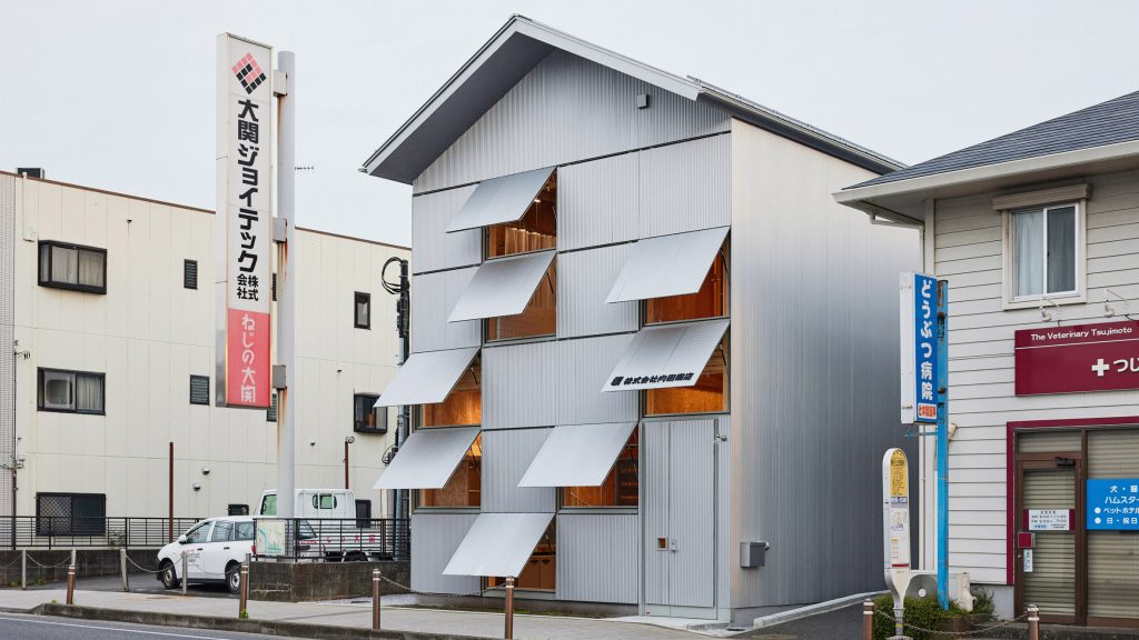 Schemata Architects creates house-like office with metal awnings