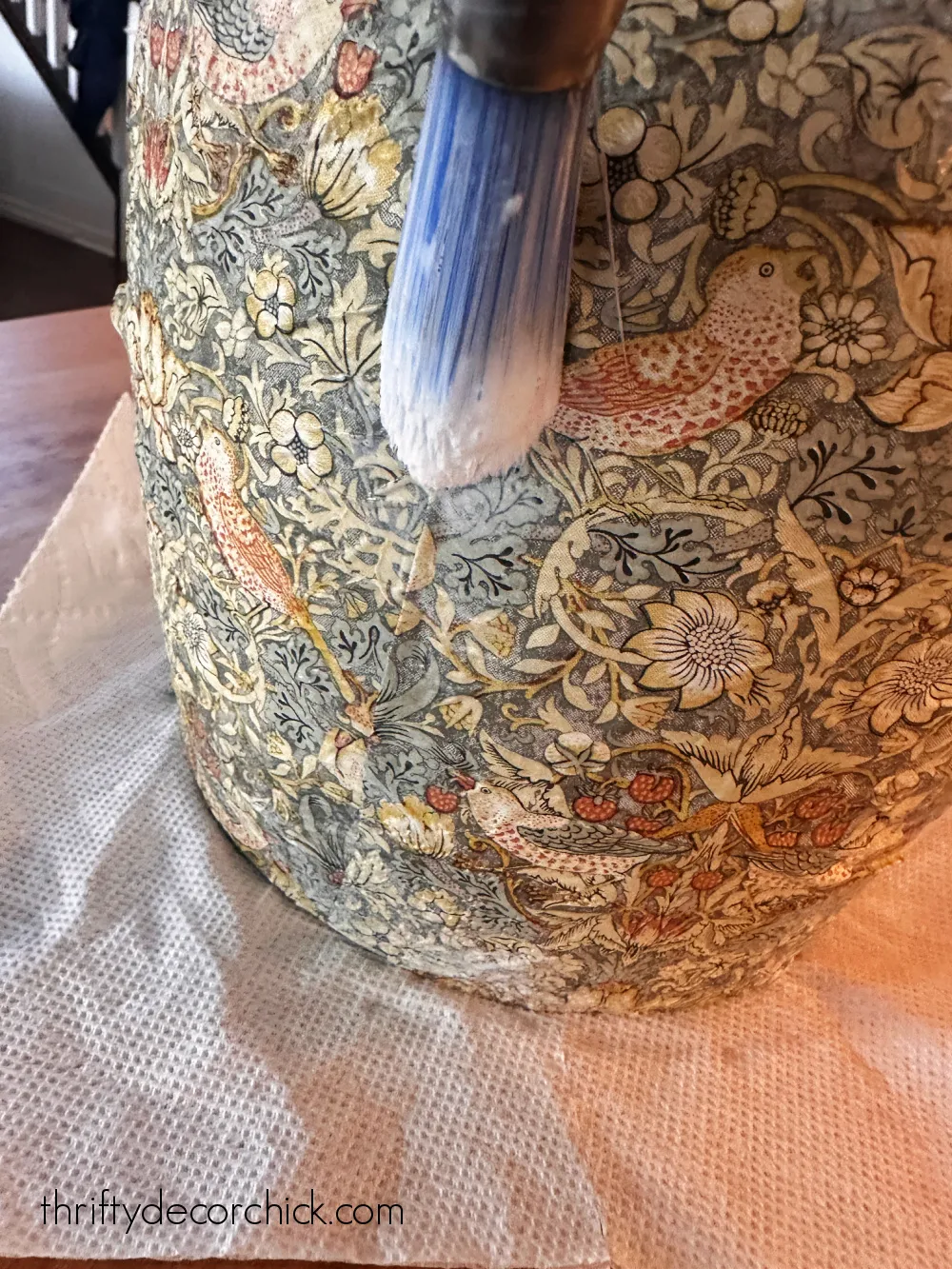 mod podge napkin onto vase