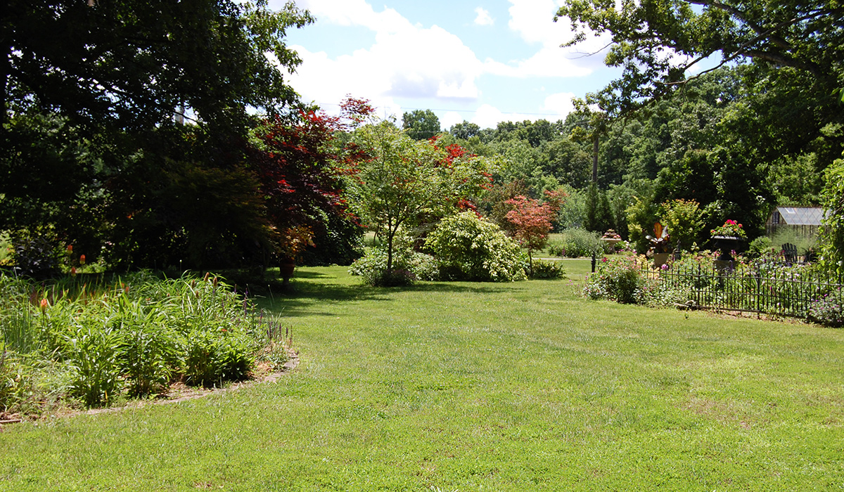 gardens around large lawn area