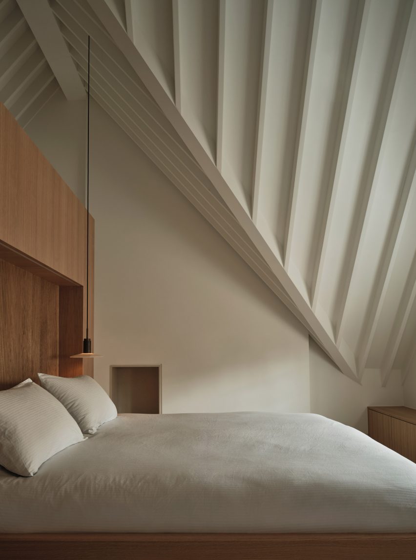 white bedroom with sloped ceilings