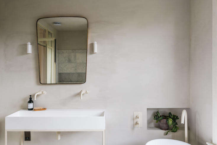 all the fixtures, powder coated oyster white, are by studio ore. the 1950s ita 20