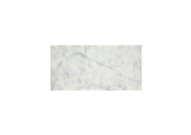 the calacatta honed marble tiles on the walls and floors are from mandarin ston 23