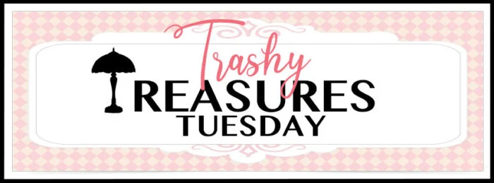 a banner with a pink checkered background reads trashy treasures tuesday. the word trashy is in pink script above treasures tuesday in black, with a black silhouette of a lamp—perfect inspiration if you’re learning how to paint laminate furniture.