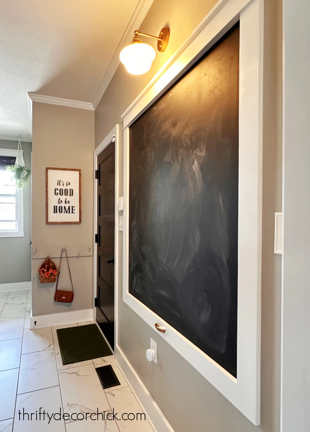 chalkboard wall with sconce