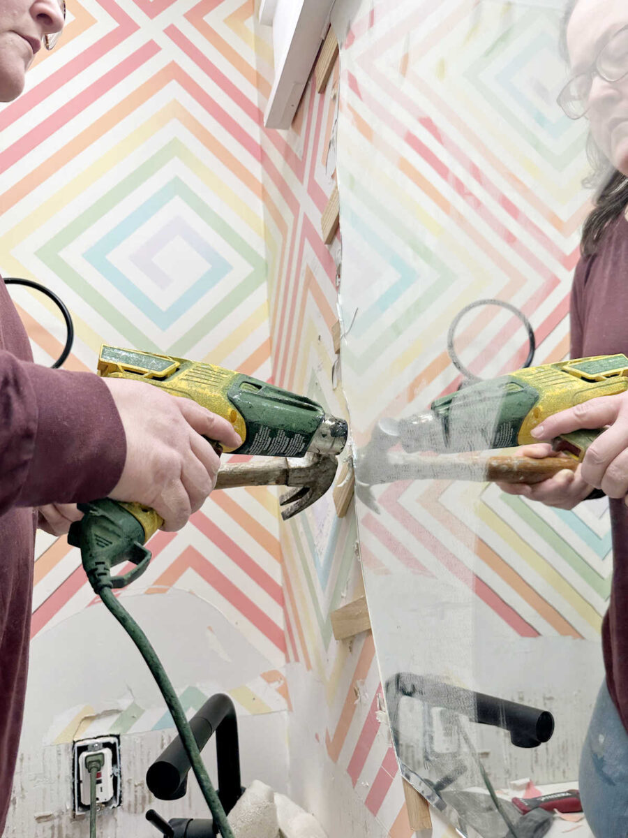 studio bathroom - mirror removal and wall prep 3 using a heat gun and shims to remove a bathroom mirror that is glued to the wall