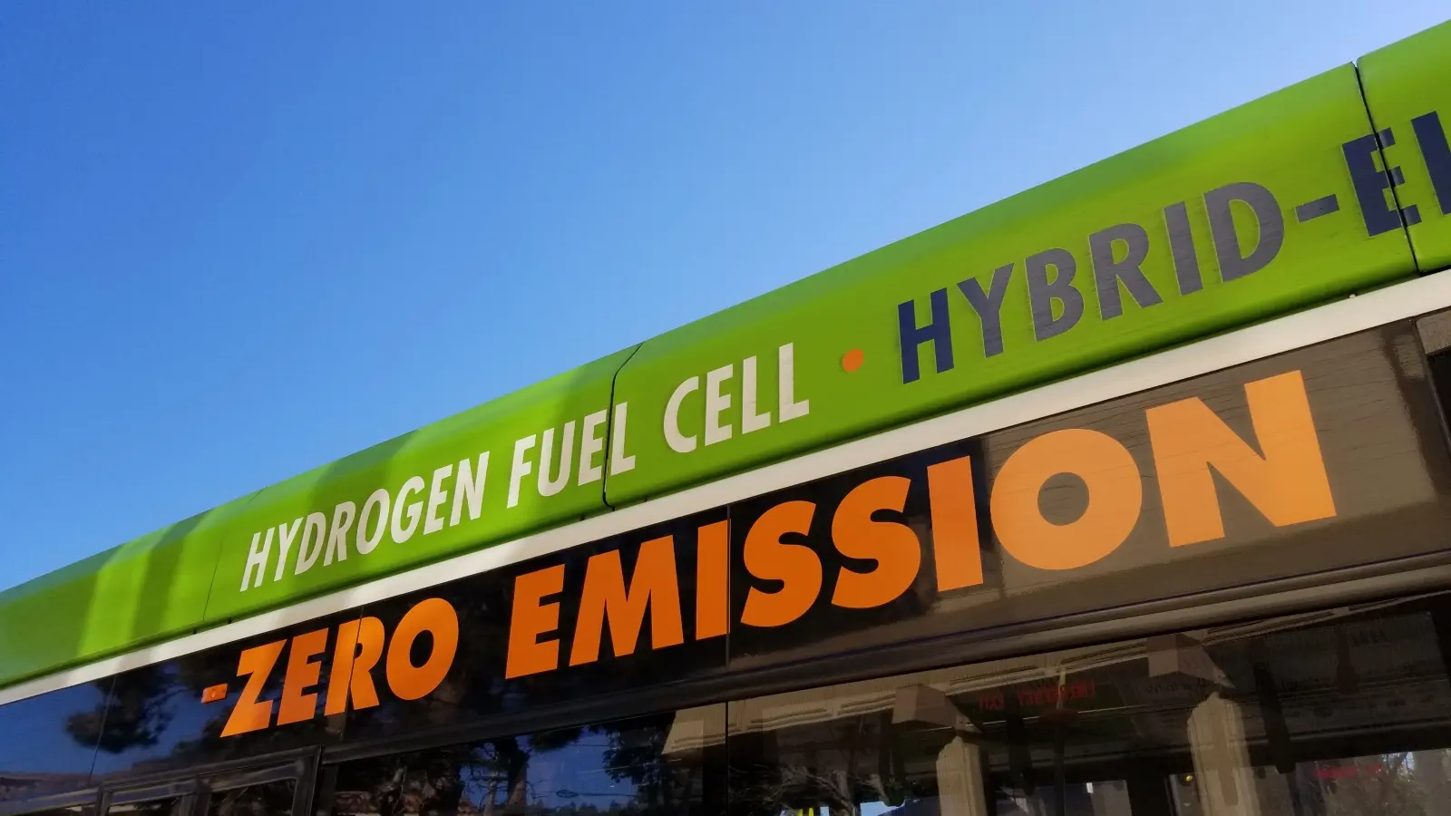 close-up of text reading hydrogen fuel cell zero emission on the side of a city bus in albany, california, indicating that the bus is powered by a hydrogen fuel cell technology, december 13, 2018.