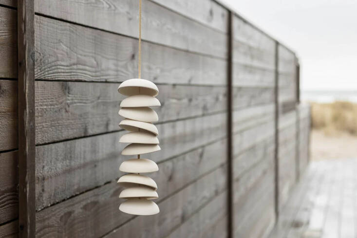 the porcelain wind chime from pigeon toe ceramics in portland, oregon, is made from a series of ceramic disks strung together on a deerskin lace cord; $85, available in a range of colors (shown in a natural glaze).