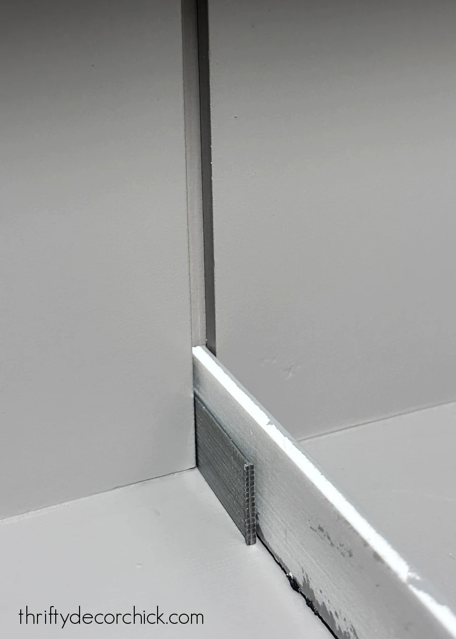 how to remove sticky peel & stick tile {& my replacement!} | thrifty decor chick 35 spacer between vertical planks on wall