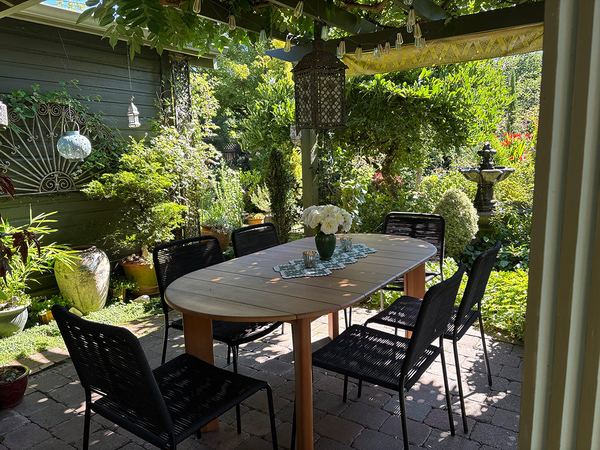 garden seating area under arbor