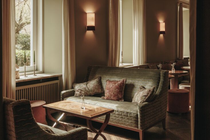 the luna bar and luna restaurant sit adjacent to the hotel, conceived as social 21