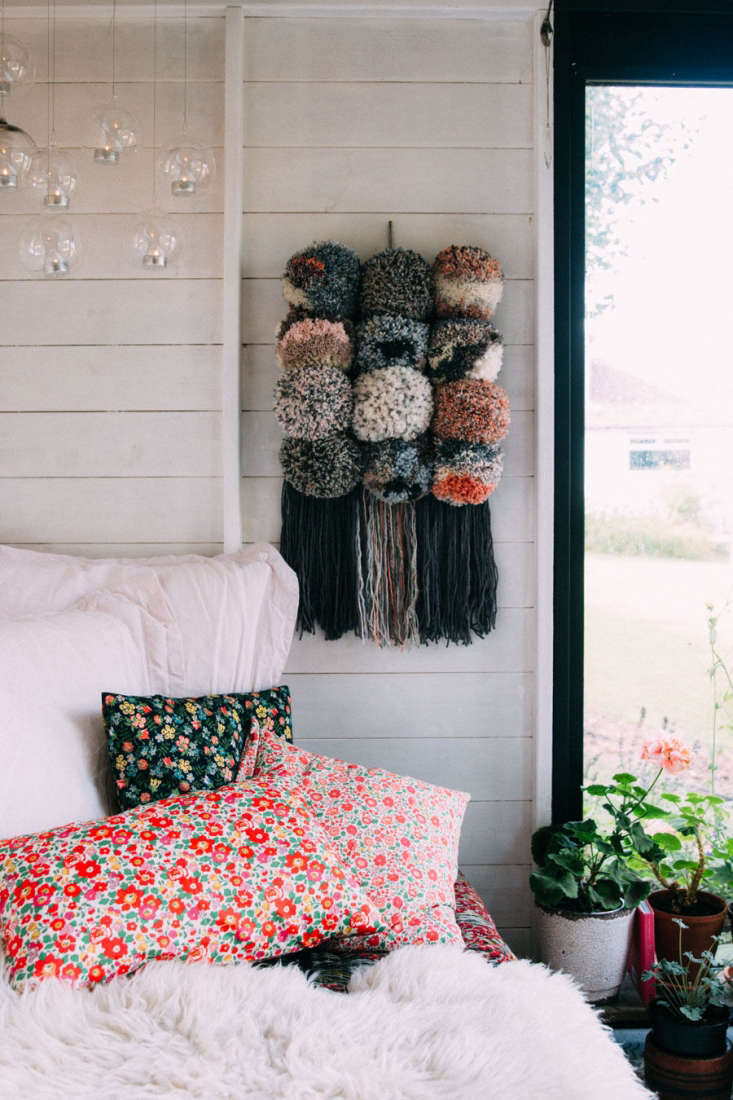 jeska layered the daybed with colorful mix-and-match textiles, including pillows covered in floral tana lawn cotton fabric.