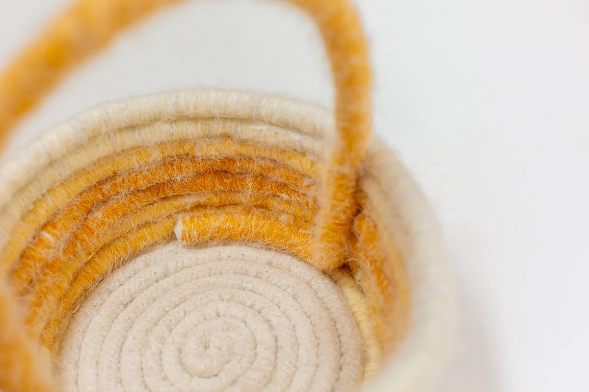 closeup of handle being attached to diy easter basket